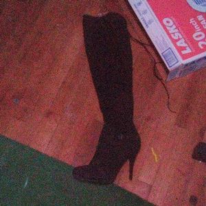 Thigh high black heeled boots